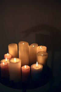 Close-up of illuminated candles on table