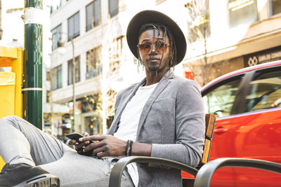 Portrait of man on street in city