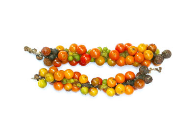 Close-up of berries against white background