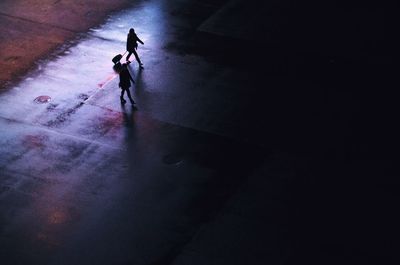 High angle view of people walking on road