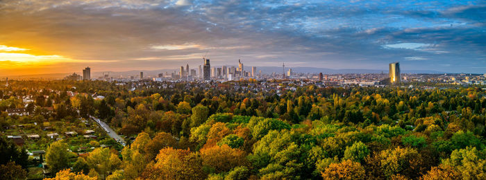 View of cityscape against cloudy sky