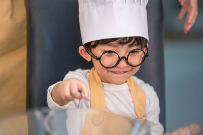 Portrait of boy holding ice cream