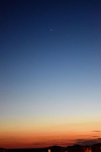 Scenic view of silhouette landscape against clear sky at sunset