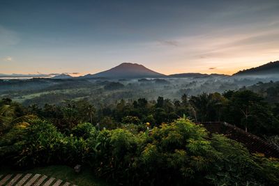 Scenic view of mountains against sky at sunset