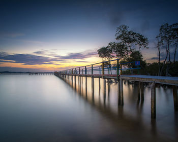 Scenic view of river against sky during sunset