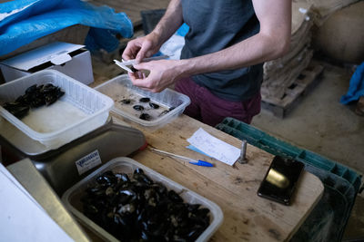 Cropped image of man working in workshop