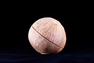 Close-up of bread against black background