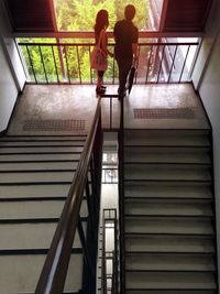 Low angle view of woman standing on stairs