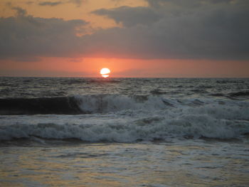 Scenic view of sea against sky during sunset