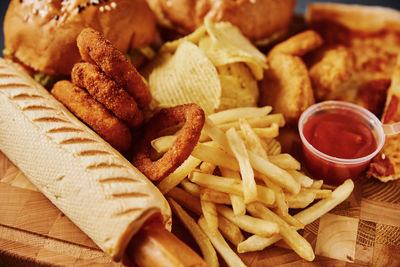 Close-up of fries and vegetables on table