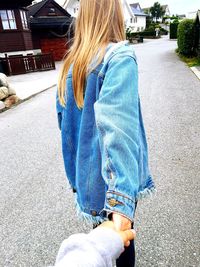 Woman standing on road