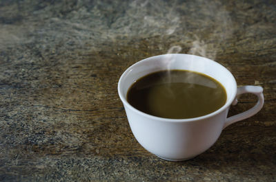 High angle view of coffee cup on table