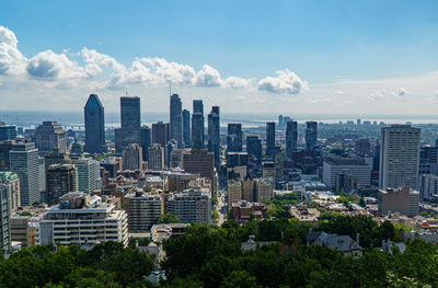 Modern buildings in city against sky