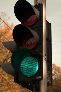 Low angle view of road signal in city