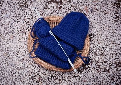 High angle view of blue knit hat in basket