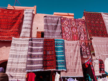 Low angle view of multi colored for sale at market stall