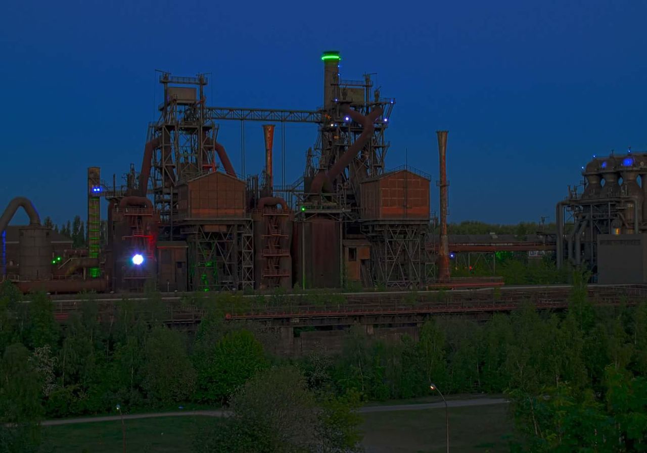 FACTORY AGAINST SKY AT NIGHT
