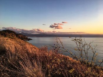 Scenic view of sea against sky at sunset