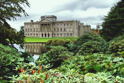 Low angle view of building against cloudy sky