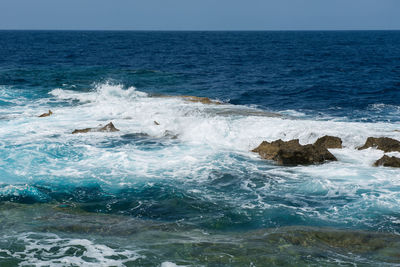 Powerful waves crushing on a rocky beach. rocky coastline and sea