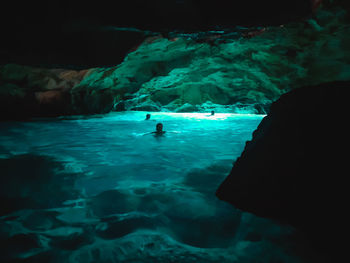 People swimming in sea