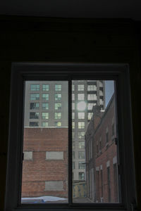 Reflection of building on glass window