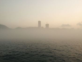 Scenic view of sea against sky during foggy weather