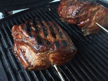 Close-up of meat on barbecue grill