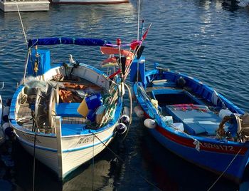 Boats moored at harbor