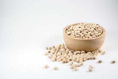 High angle view of bread in bowl against white background