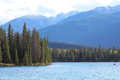 Scenic view of lake and mountains against sky