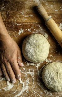 Close-up of person preparing food on table