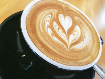 Close-up of cappuccino on table