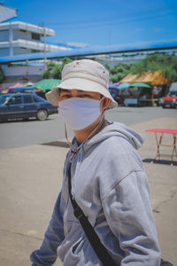 Portrait of senior man standing on road