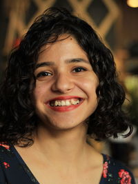 Close-up portrait of a smiling young woman