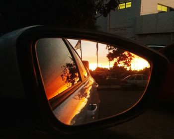 Reflection of car on side-view mirror