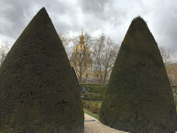 Low angle view of building against cloudy sky