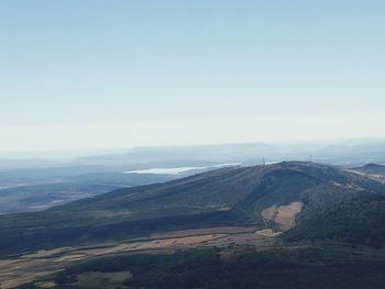 High angle view of dramatic landscape against sky during foggy weather