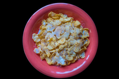 Directly above shot of breakfast in bowl against black background