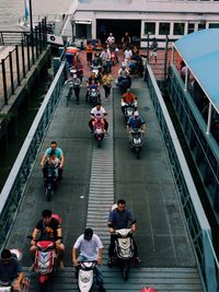 High angle view of people walking on sidewalk in city