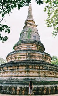 Low angle view of temple against building