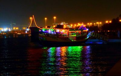 Boats in lake at night