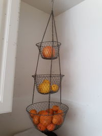 Close-up of orange fruit hanging on wall