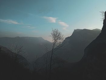 Scenic view of silhouette mountains against sky