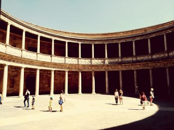 Tourist at palace of charles v against sky