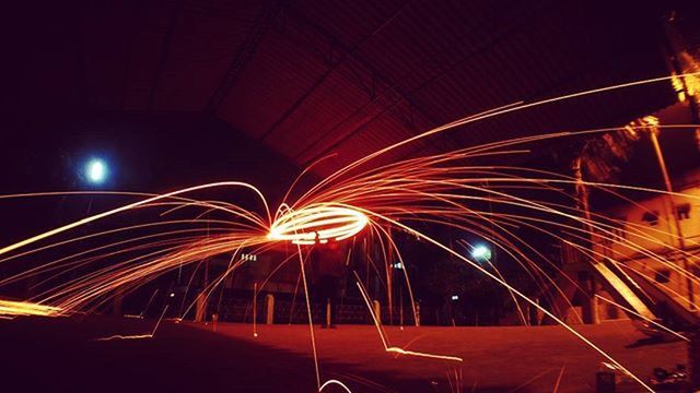 illuminated, night, long exposure, light trail, lighting equipment, motion, light - natural phenomenon, built structure, glowing, dark, architecture, indoors, blurred motion, arts culture and entertainment, light, tunnel, low angle view, no people, speed, electric light