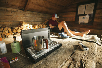 Young man at campsite barefoot