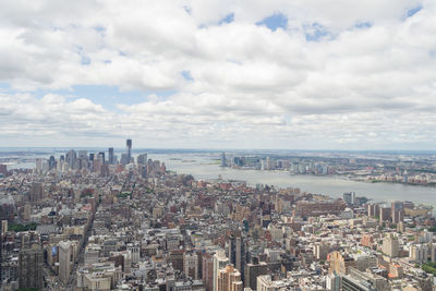 High angle view of modern buildings in city against sky