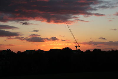 Silhouette trees against sky during sunset