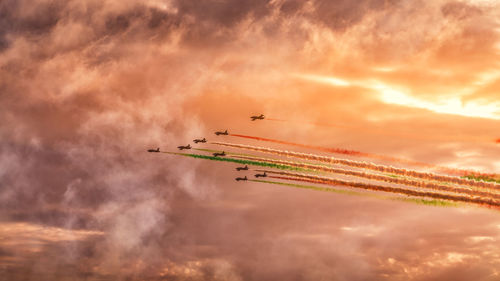 Low angle view of airplane flying against sky